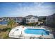 Aerial view of the community pool and surrounding homes with a beautiful pond at 601 Hillside Dr. N # 1731, North Myrtle Beach, SC 29582