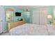 Charming bedroom featuring a queen-size bed, beach accents, dresser, and closet at 613 South Ocean Blvd. # O-2, North Myrtle Beach, SC 29582