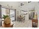 Cozy dining area with a view of the kitchen and a sliding glass door leading to a patio at 617 S 13Th Ave. # 116, Surfside Beach, SC 29575