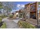 Property featuring a brown and white exterior, landscaped front yard, and a tree in the front at 617 S 13Th Ave. # 116, Surfside Beach, SC 29575