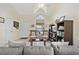 Inviting living room featuring a vaulted ceiling, ceiling fan, tile flooring, and a comfortable seating area at 617 S 13Th Ave. # 116, Surfside Beach, SC 29575