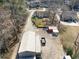 Aerial shot of a home on a large lot featuring a long drive, outbuildings, and mature trees, providing privacy at 639 Blackstone Dr., Myrtle Beach, SC 29588