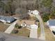 Aerial view of a well-maintained single-Gathering home with a large lot, mature trees, and a two-car garage at 639 Blackstone Dr., Myrtle Beach, SC 29588