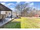 Backyard featuring a well-maintained lawn, patio, and a large mature tree at 639 Blackstone Dr., Myrtle Beach, SC 29588