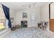 Bonus room with a large rug, decor, lots of natural light, and a cat tree at 639 Blackstone Dr., Myrtle Beach, SC 29588