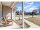 Inviting front porch with seating, landscaping and sidewalk views of the neighborhood at 639 Blackstone Dr., Myrtle Beach, SC 29588