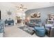 Spacious living room with a ceiling fan, unique decorations, and a view of the dining area at 639 Blackstone Dr., Myrtle Beach, SC 29588