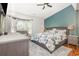 Bright bedroom with a bay window, en-suite bath, carpet, and a decorative accent wall at 639 Blackstone Dr., Myrtle Beach, SC 29588