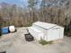 Spacious outbuilding with trailer and other equipment on a large lot surrounded by trees at 639 Blackstone Dr., Myrtle Beach, SC 29588