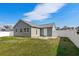 Spacious backyard with a patio, and white vinyl fence at 9840 Conifer Ln., Murrells Inlet, SC 29576