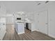 Bright kitchen showcasing white cabinets, stainless steel appliances, and a center island at 9840 Conifer Ln., Murrells Inlet, SC 29576