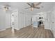 Open-concept kitchen with a blue island, white cabinets, and modern stainless-steel appliances at 9840 Conifer Ln., Murrells Inlet, SC 29576