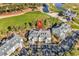 Overhead view of condos with a well-manicured golf course and pond, nestled in a beautiful, wooded area at 104 Cypress Point Ct. # 302, Myrtle Beach, SC 29579