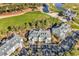 Overhead view of condos with a well-manicured golf course and pond, nestled in a beautiful, wooded area at 104 Cypress Point Ct. # 302, Myrtle Beach, SC 29579