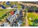 Aerial view showcasing condos, pool, manicured golf course, and a beautiful pond, framed by lush, mature trees at 104 Cypress Point Ct. # 302, Myrtle Beach, SC 29579
