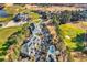 Scenic aerial view of condos, pool, manicured golf course, and a beautiful pond, surrounded by lush, mature trees at 104 Cypress Point Ct. # 302, Myrtle Beach, SC 29579