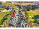 Scenic aerial view of condos, pool, manicured golf course, and a beautiful pond, surrounded by lush, mature trees at 104 Cypress Point Ct. # 302, Myrtle Beach, SC 29579