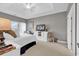 This bedroom has a white dresser with a TV on it and a tray ceiling at 104 Cypress Point Ct. # 302, Myrtle Beach, SC 29579