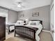 Bright bedroom featuring two beds, light colored walls, and a ceiling fan at 104 Cypress Point Ct. # 302, Myrtle Beach, SC 29579