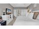 This is a bedroom with a king bed, TV, dresser, and a bathroom at 104 Cypress Point Ct. # 302, Myrtle Beach, SC 29579