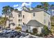 Beautiful condominium building showcasing a well-maintained exterior and ample parking at 104 Cypress Point Ct. # 302, Myrtle Beach, SC 29579