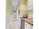 Hallway with a wood countertop, white cabinets, and art on the walls at 104 Cypress Point Ct. # 302, Myrtle Beach, SC 29579