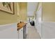 Hallway with a wood countertop, white cabinets, and doors with a glimpse of the living room at 104 Cypress Point Ct. # 302, Myrtle Beach, SC 29579