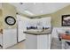 Bright kitchen features white cabinetry, granite countertops, and modern appliances at 104 Cypress Point Ct. # 302, Myrtle Beach, SC 29579