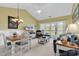 Open-concept living and dining area with natural light and a view of the outdoors at 104 Cypress Point Ct. # 302, Myrtle Beach, SC 29579