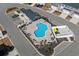 Aerial view of a community pool featuring plenty of lounge seating and shaded areas at 115 Galil Dr. # B, Myrtle Beach, SC 29579