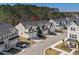 Aerial view of modern townhomes featuring attached garages, paved driveways, and landscaped yards at 115 Galil Dr. # B, Myrtle Beach, SC 29579