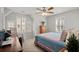Cozy bedroom featuring natural light, a rocking chair, and a wooden dresser with decorative accents at 115 Galil Dr. # B, Myrtle Beach, SC 29579