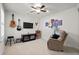 Relaxing bonus room with a ceiling fan, comfortable recliner, entertainment center, and wall decor at 115 Galil Dr. # B, Myrtle Beach, SC 29579