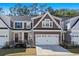 Charming two-story home with attached garage, neat landscaping, and a welcoming entrance at 115 Galil Dr. # B, Myrtle Beach, SC 29579