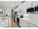 Lovely kitchen featuring white cabinets, stainless steel appliances, subway tile backsplash, and hardwood floors at 115 Galil Dr. # B, Myrtle Beach, SC 29579