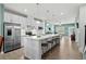 Modern kitchen boasting stainless steel appliances, sleek white cabinetry, and a center island with bar stool seating at 115 Galil Dr. # B, Myrtle Beach, SC 29579