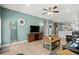 Open-concept living room with stylish furniture, a ceiling fan, and seamlessly connected to the kitchen area at 115 Galil Dr. # B, Myrtle Beach, SC 29579