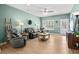 Inviting living room with comfortable seating, a ceiling fan, and plenty of natural light streaming through the window at 115 Galil Dr. # B, Myrtle Beach, SC 29579