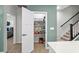 Organized pantry with shelving, ample storage space, and easy access from the kitchen and nearby stairs at 115 Galil Dr. # B, Myrtle Beach, SC 29579