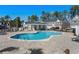 Community pool surrounded by lounge chairs and tables, perfect for summer relaxation at 115 Galil Dr. # B, Myrtle Beach, SC 29579