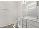 Bathroom featuring double sinks, white cabinets, wood flooring, and toilet at 1200 Cypress Shoal Dr., Conway, SC 29526
