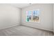 Neutral bedroom has carpeting, a window and a view of the neighborhood at 1200 Cypress Shoal Dr., Conway, SC 29526