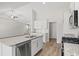 Modern kitchen featuring white cabinets, granite countertops, stainless steel appliances and wood floors at 1200 Cypress Shoal Dr., Conway, SC 29526