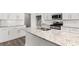 This modern kitchen boasts white cabinets, granite countertops, stainless steel appliances and subway tile backsplash at 1200 Cypress Shoal Dr., Conway, SC 29526