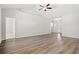 Expansive living room features wood floors, creating a warm and inviting atmosphere for gatherings at 1200 Cypress Shoal Dr., Conway, SC 29526