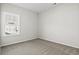 Neutral carpeted bedroom features one window allowing lots of natural light at 1206 Cypress Shoal Dr., Conway, SC 29526