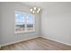 Bright dining room with modern chandelier and large window at 1206 Cypress Shoal Dr., Conway, SC 29526