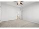 Spacious primary bedroom with carpet flooring and ceiling fan at 1206 Cypress Shoal Dr., Conway, SC 29526