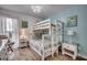 Charming bedroom featuring a bunk bed and a side table with a lamp at 126 N Waccamaw Dr. # 203, Garden City Beach, SC 29576