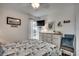 Comfortable bedroom featuring nautical decor, a ceiling fan, and a view to the outside at 126 N Waccamaw Dr. # 203, Garden City Beach, SC 29576